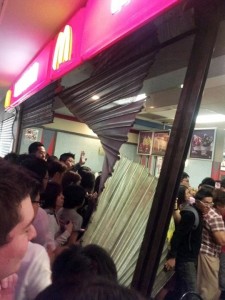 Crowd tears through the shutters at Prangin Mall, Penang (Image via Says.com, Photo: Desmond Ooi)